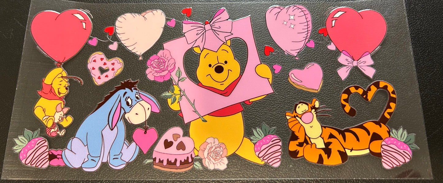Winnie Pooh with heart balloons