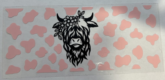 Highland cow with pink spots