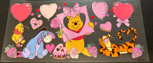 Winnie Pooh with heart balloons